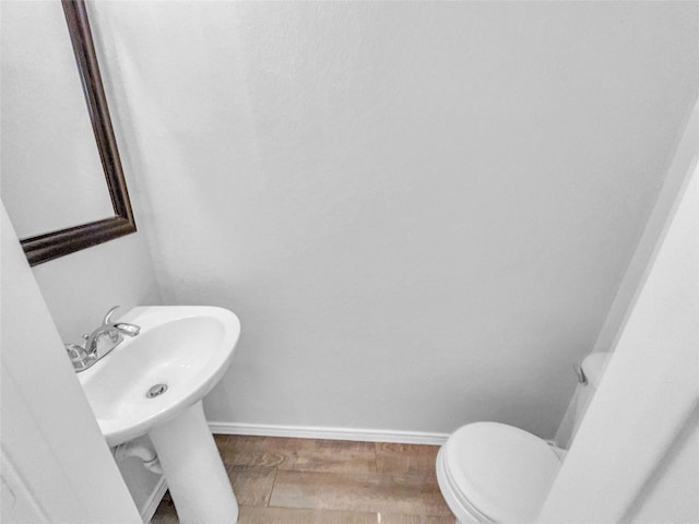 1825 Heron Dr, Aubrey, TX 76227 - half bath with baseboards, wood finished floors, and toilet