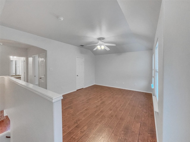 1825 Heron Dr, Aubrey, TX 76227 - empty room featuring wood finished floors, a ceiling fan, lofted ceiling, and baseboards