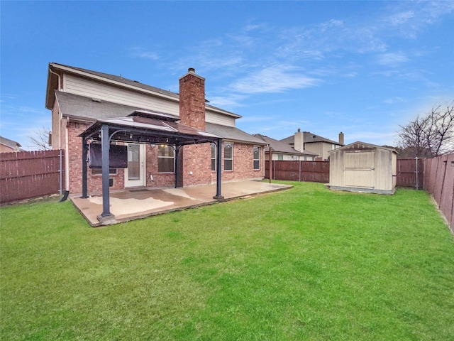 1825 Heron Dr, Aubrey, TX 76227 - rear view of house featuring a gazebo, brick siding, a patio, and a storage unit
