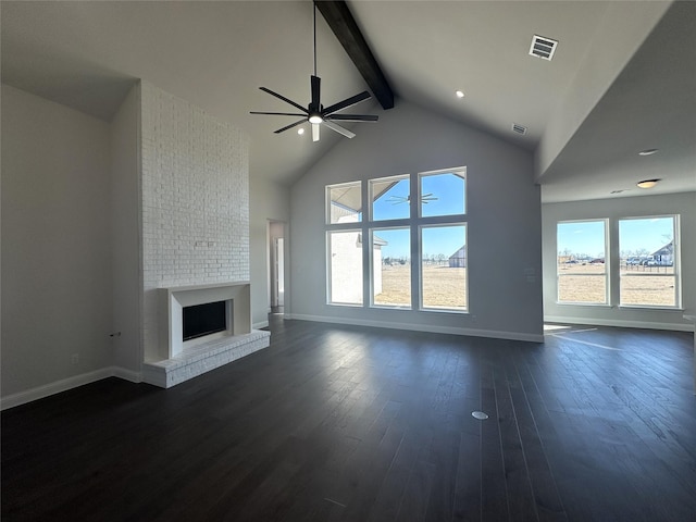 unfurnished living room with visible vents, dark wood-type flooring, a brick fireplace, high vaulted ceiling, and beam ceiling