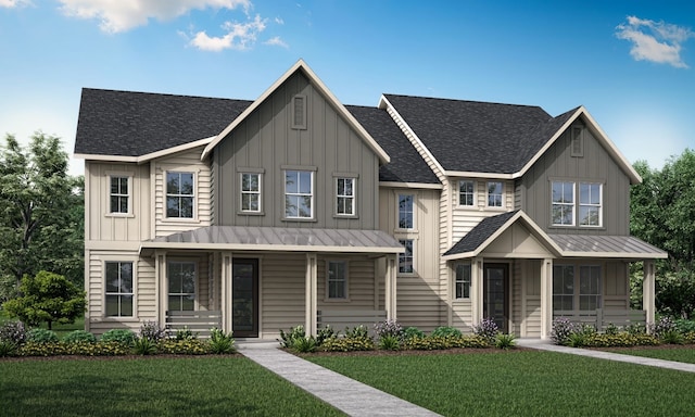 view of front of house with covered porch, a front lawn, board and batten siding, and a standing seam roof