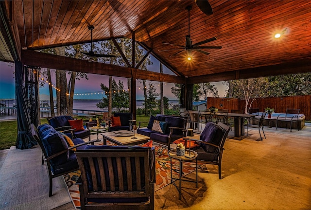 view of patio / terrace with an outdoor hangout area, ceiling fan, and fence