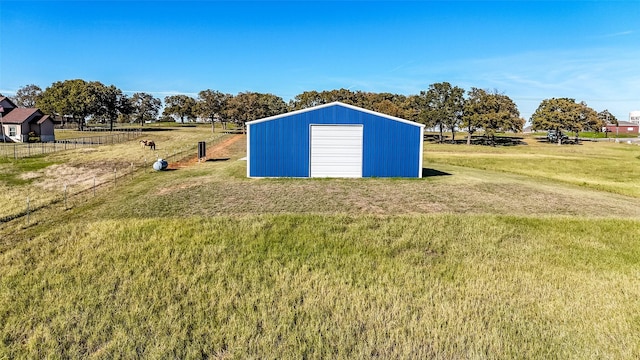 view of outbuilding featuring an outbuilding and fence