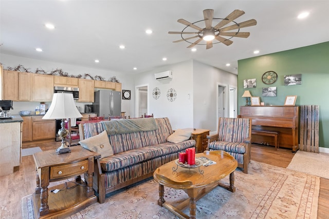 living area with light wood-type flooring, recessed lighting, ceiling fan, and a wall mounted AC