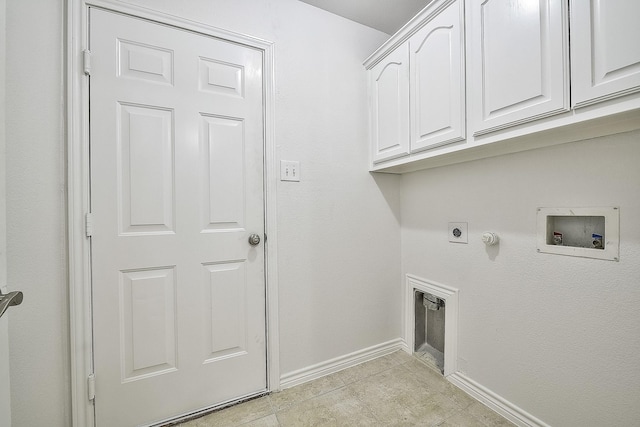 washroom featuring gas dryer hookup, hookup for a washing machine, hookup for an electric dryer, baseboards, and cabinet space