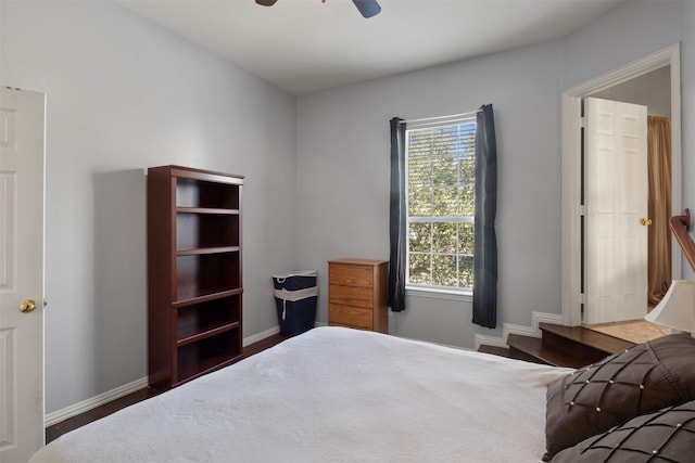 bedroom featuring ceiling fan and baseboards