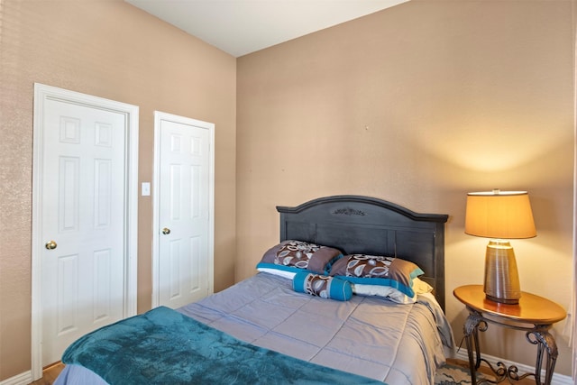 bedroom featuring baseboards