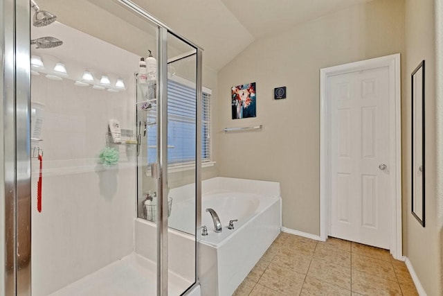 full bathroom featuring baseboards, a garden tub, tile patterned flooring, vaulted ceiling, and a shower stall