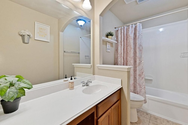 full bathroom featuring tile patterned flooring, vanity, toilet, and shower / tub combo with curtain