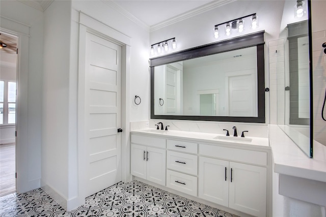 bathroom featuring double vanity, crown molding, a sink, and tile patterned floors