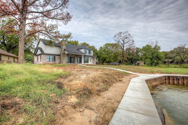 exterior space featuring brick siding