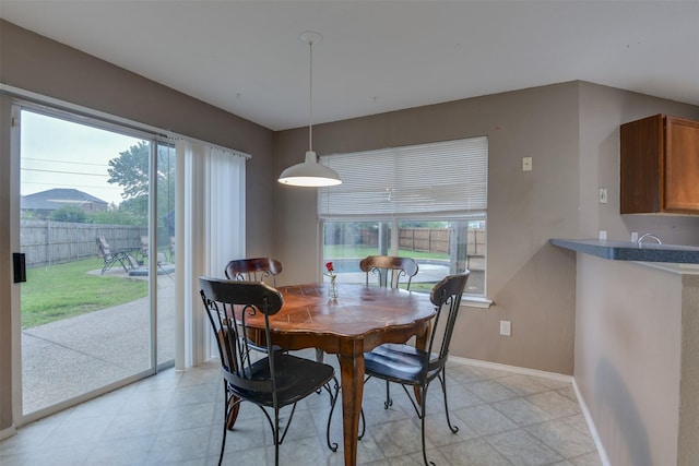 dining space with baseboards