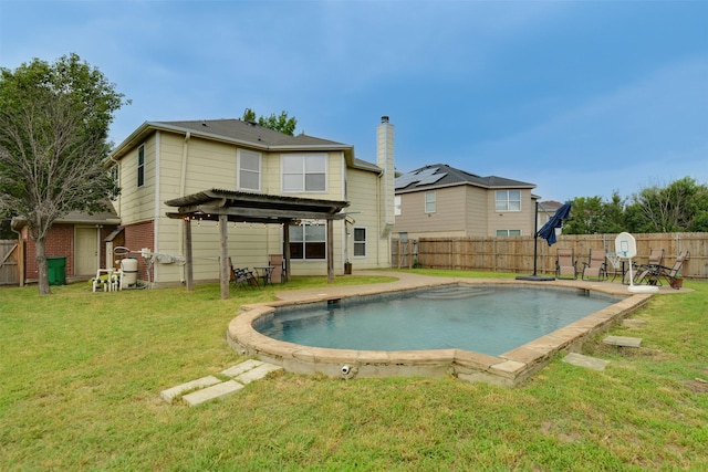 back of house with a fenced in pool, a fenced backyard, a lawn, and a pergola