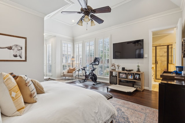 bedroom featuring ornamental molding, dark wood finished floors, and baseboards