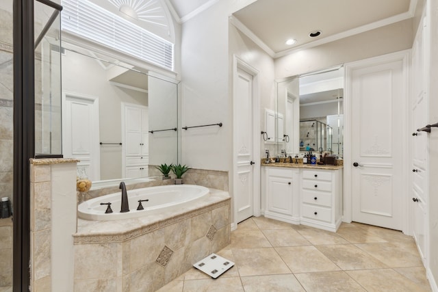 full bathroom with a garden tub, crown molding, a stall shower, vanity, and tile patterned flooring