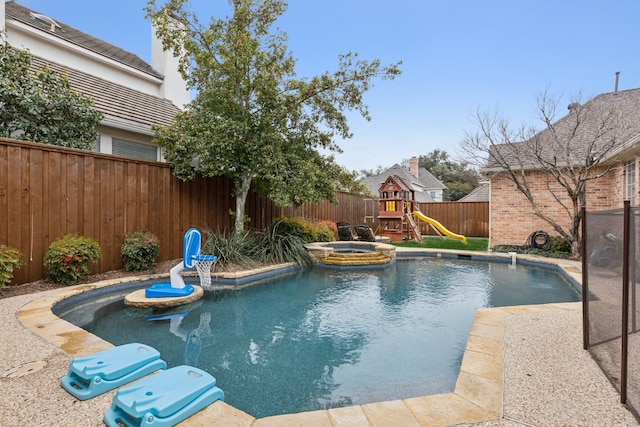 view of swimming pool with a fenced backyard, a pool with connected hot tub, and a playground