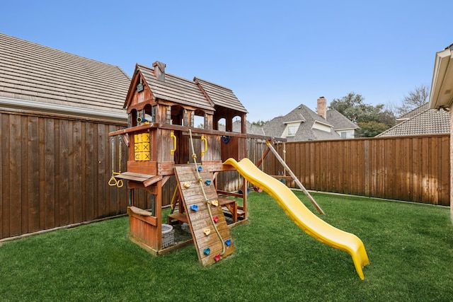 view of playground with fence private yard and a yard