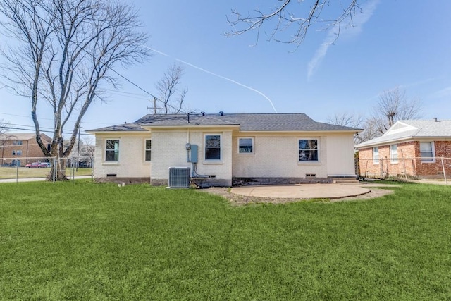 rear view of house featuring central AC, fence, a lawn, and crawl space