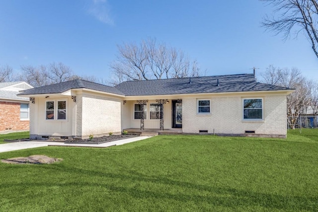 ranch-style home featuring a front yard, brick siding, roof with shingles, and crawl space