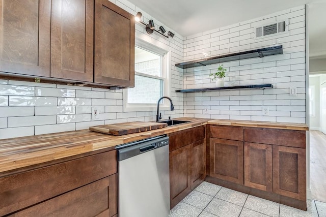 kitchen with tasteful backsplash, visible vents, stainless steel dishwasher, open shelves, and wooden counters