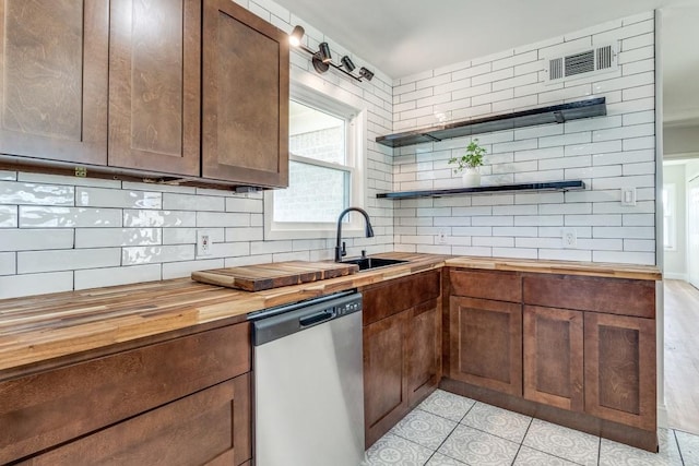 kitchen featuring backsplash, open shelves, wooden counters, visible vents, and dishwasher