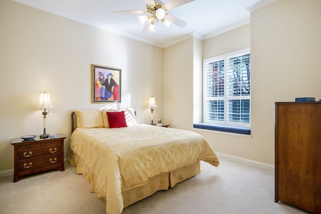 bedroom with a ceiling fan, baseboards, crown molding, and light colored carpet