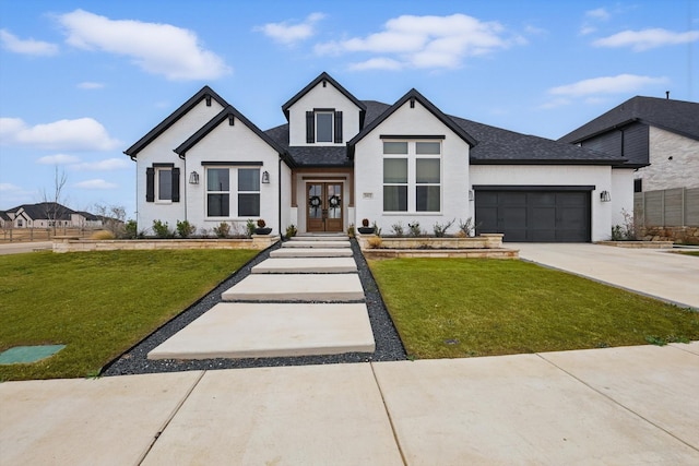 2412 Strolling Way, Argyle, TX 76226 - view of front of property featuring french doors, a front lawn, concrete driveway, and an attached garage