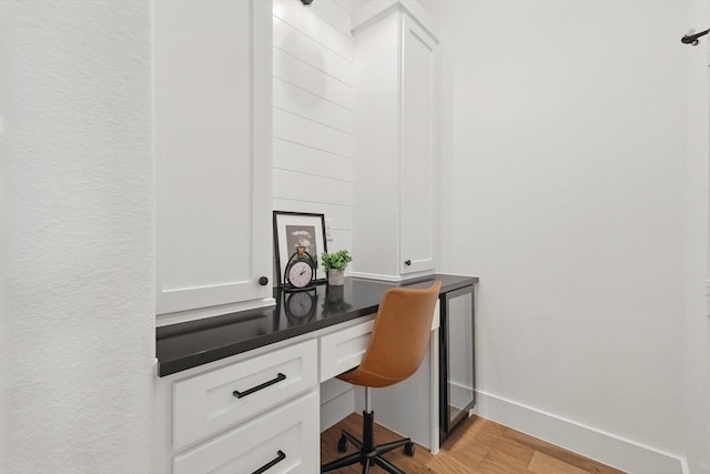 2412 Strolling Way, Argyle, TX 76226 - office area with built in desk, light wood-style floors, and baseboards