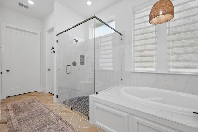 full bath featuring a bath, a marble finish shower, visible vents, and recessed lighting