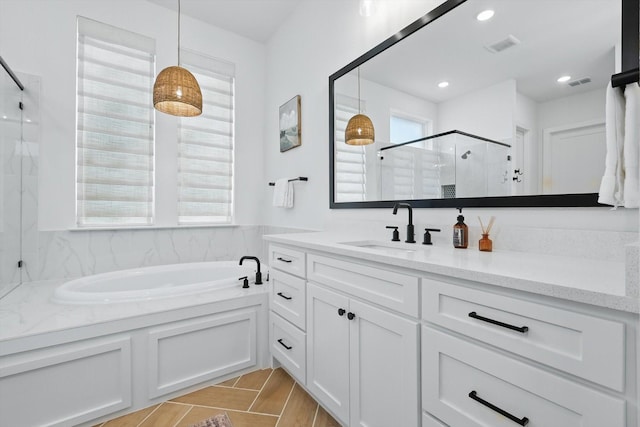 full bath with a shower stall, visible vents, a bath, and vanity