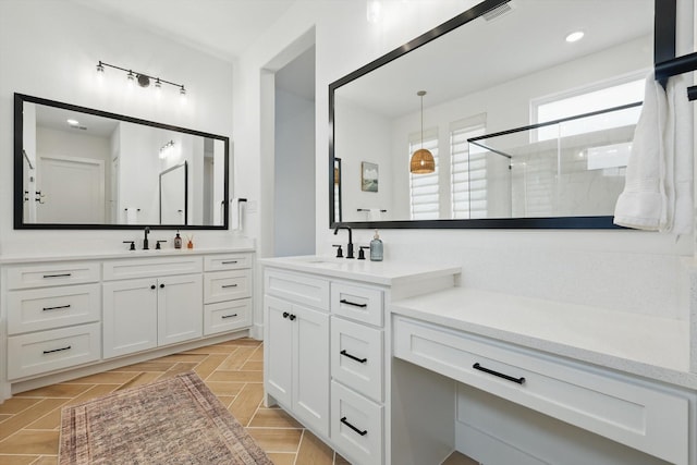 full bath with a stall shower, vanity, visible vents, and recessed lighting