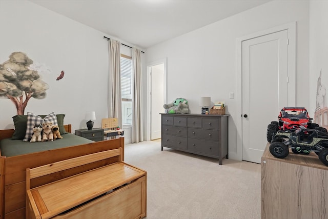 bedroom with light colored carpet