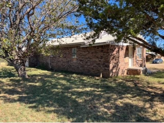 view of property exterior featuring a yard