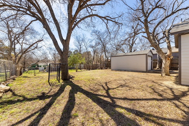 view of yard featuring a fenced backyard, an outdoor structure, and a storage shed