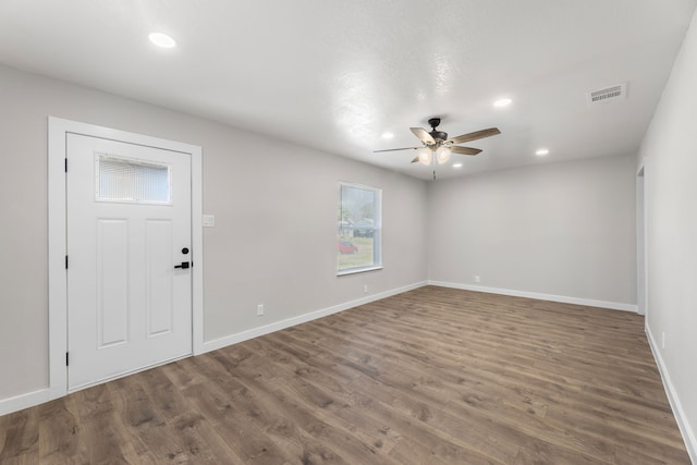 foyer with baseboards, visible vents, wood finished floors, and recessed lighting