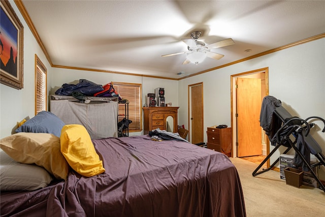 bedroom with crown molding, a ceiling fan, and light colored carpet