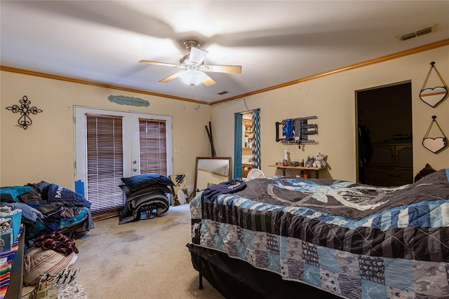 carpeted bedroom featuring ceiling fan, visible vents, crown molding, and french doors