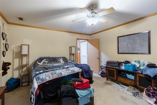 bedroom featuring carpet floors, visible vents, ornamental molding, and ceiling fan