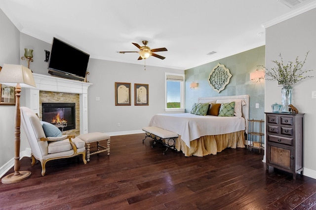 bedroom with dark wood-style floors, a fireplace, visible vents, and ornamental molding