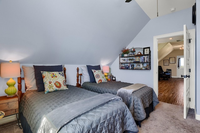 carpeted bedroom featuring lofted ceiling