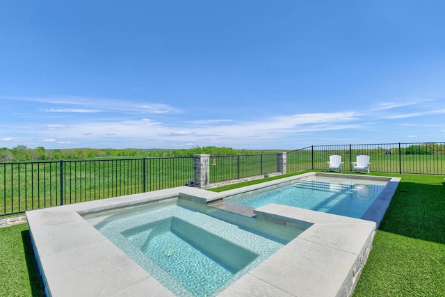 view of swimming pool featuring a pool with connected hot tub, a fenced backyard, and a lawn