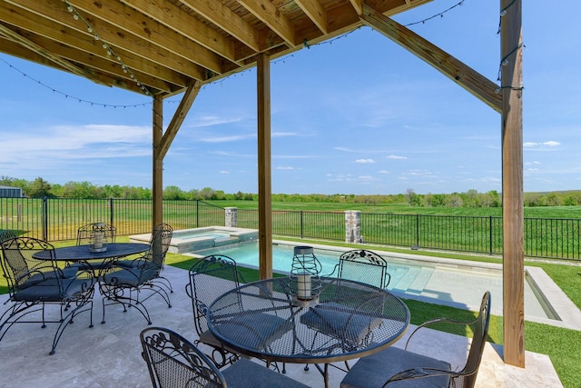 view of patio / terrace with outdoor dining area, a fenced backyard, and a pool with connected hot tub