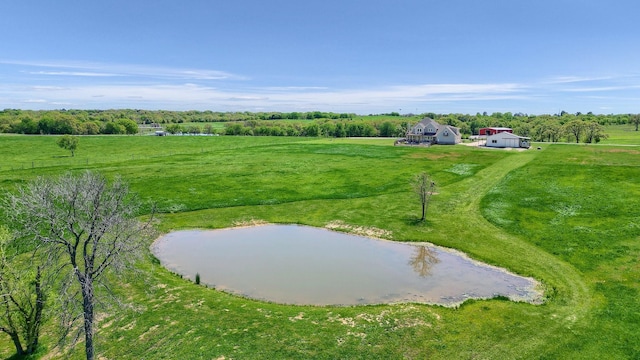 birds eye view of property with a water view and a rural view