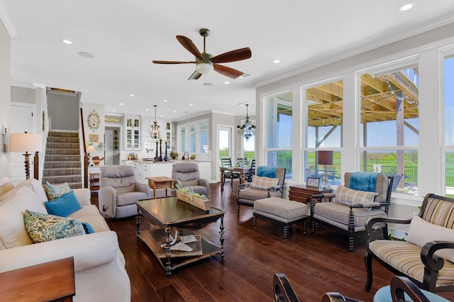 living room with a ceiling fan, stairway, ornamental molding, dark wood-type flooring, and recessed lighting