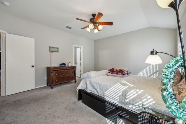 bedroom with vaulted ceiling, ceiling fan, light carpet, and visible vents