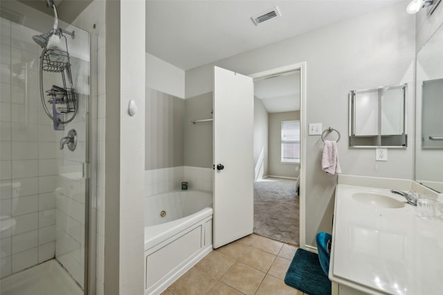 bathroom featuring vanity, visible vents, a jetted tub, a shower stall, and tile patterned floors