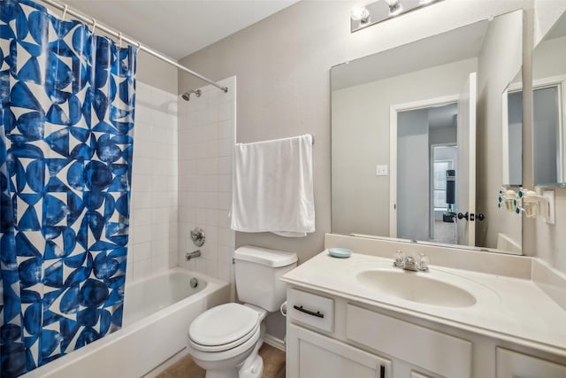 full bathroom featuring shower / tub combo, vanity, and toilet