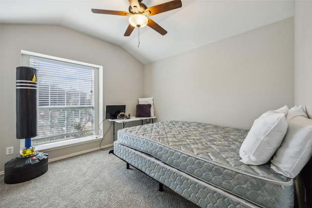 carpeted bedroom featuring lofted ceiling, ceiling fan, and baseboards