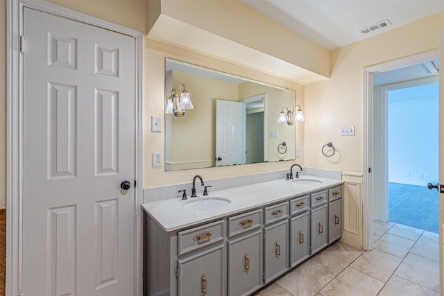 full bath with tile patterned flooring, visible vents, a sink, and double vanity