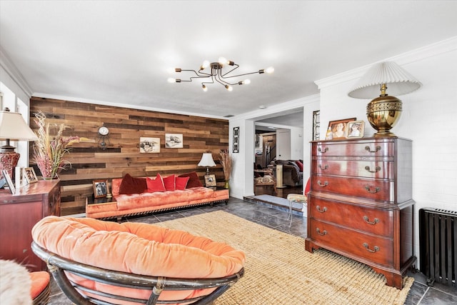 bedroom with an inviting chandelier, radiator heating unit, and ornamental molding